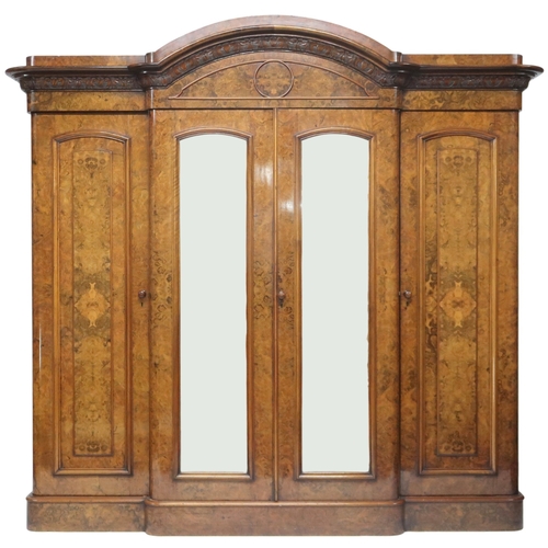 2015 - A VICTORIAN BURR WALNUT VENEERED THREE PIECE BEDROOM SUITEconsisting four door break front wardrobe ... 