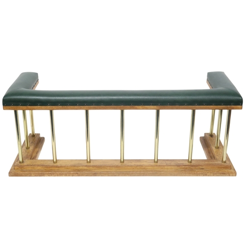 2016 - A 20TH CENTURY OAK AND BRASS CLUB FIRE FENDER with green Rexine upholstered top over brass rail... 