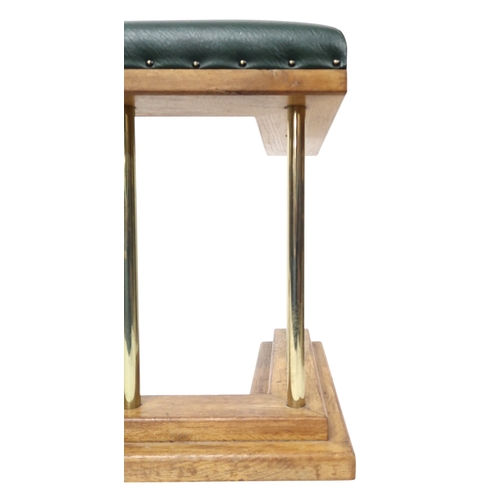 2016 - A 20TH CENTURY OAK AND BRASS CLUB FIRE FENDER with green Rexine upholstered top over brass rail... 