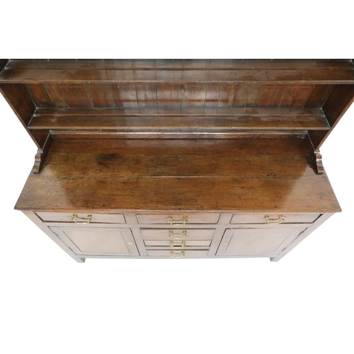 2022 - AN 18TH/19TH CENTURY OAK KITCHEN DRESSERplate rack with moulded cornice over three open shelves on b... 