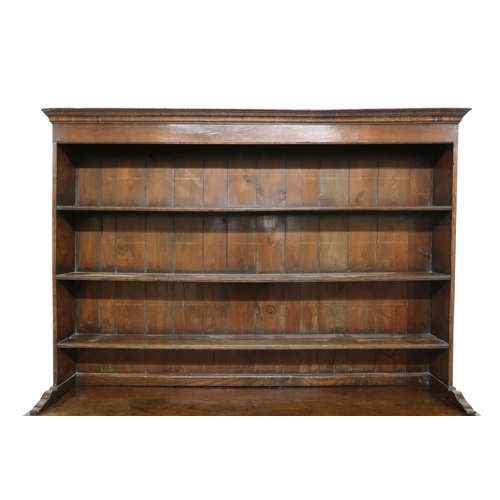 2022 - AN 18TH/19TH CENTURY OAK KITCHEN DRESSERplate rack with moulded cornice over three open shelves on b... 