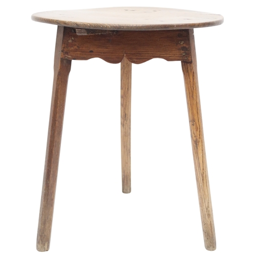 2024 - A 19TH CENTURY ASH CIRCULAR TOPPED CRICKET TABLEwith shaped fret cut aprons on three square chamfere... 