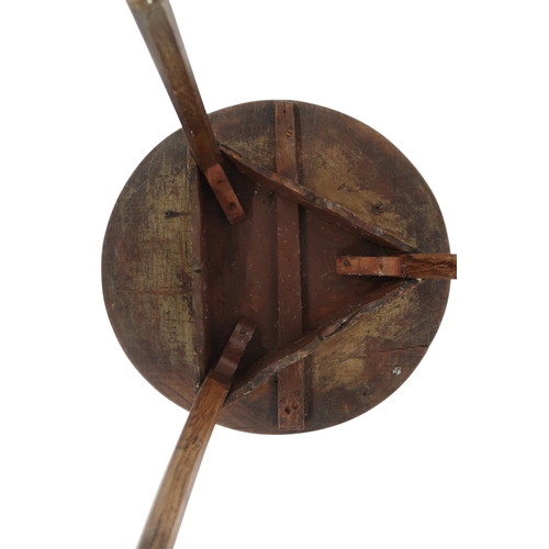 2024 - A 19TH CENTURY ASH CIRCULAR TOPPED CRICKET TABLEwith shaped fret cut aprons on three square chamfere... 