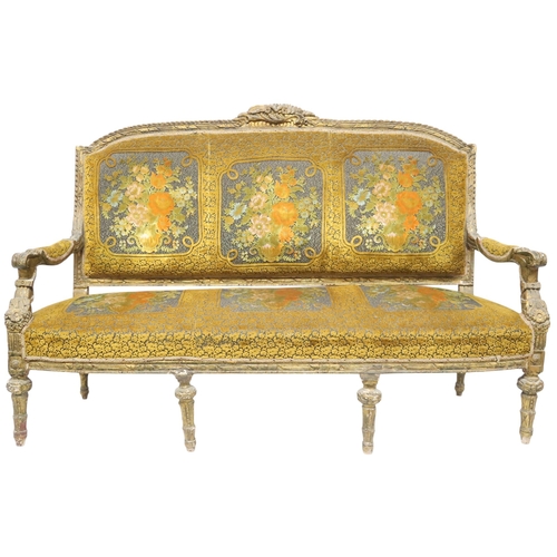 2030 - AN 18TH CENTURY LOUIS XVI GILTWOOD GESSO FRAMED SETTEEwith floral upholstered back and seat on six r... 