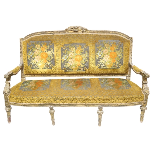 2030 - AN 18TH CENTURY LOUIS XVI GILTWOOD GESSO FRAMED SETTEEwith floral upholstered back and seat on six r... 