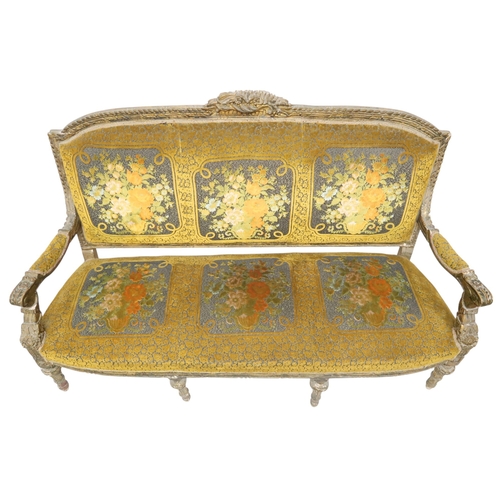 2030 - AN 18TH CENTURY LOUIS XVI GILTWOOD GESSO FRAMED SETTEEwith floral upholstered back and seat on six r... 