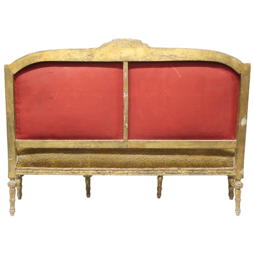 2030 - AN 18TH CENTURY LOUIS XVI GILTWOOD GESSO FRAMED SETTEEwith floral upholstered back and seat on six r... 