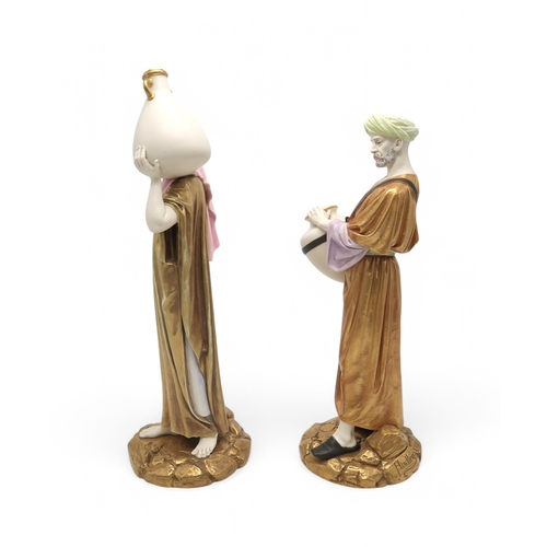 2165 - A PAIR OF LARGE ROYAL WORCESTER FIGURESmodelled as water carriers, after James Hadley, both with gil... 