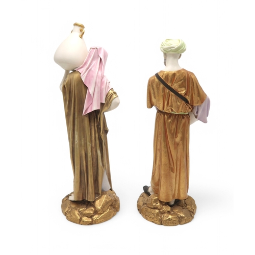 2165 - A PAIR OF LARGE ROYAL WORCESTER FIGURESmodelled as water carriers, after James Hadley, both with gil... 