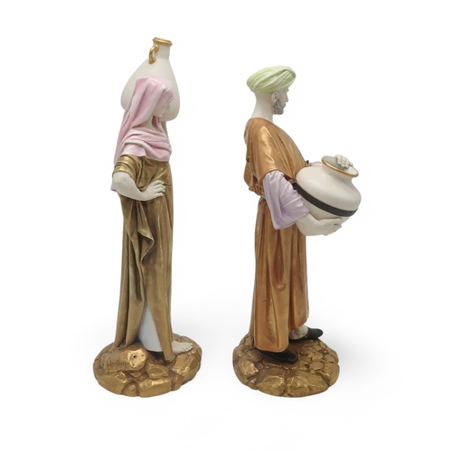 2165 - A PAIR OF LARGE ROYAL WORCESTER FIGURESmodelled as water carriers, after James Hadley, both with gil... 