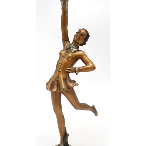 2168 - AN ART DECO SPELTER LADY LAMPmodelled wearing a short dress with one arm raised, the other on her hi... 