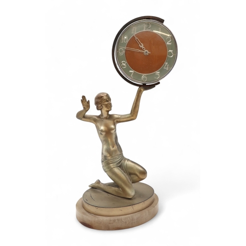 2169 - AN ART DECO FIGURAL CLOCKmodelled as a kneeling semi clad female holding aloft the circular clock, u... 