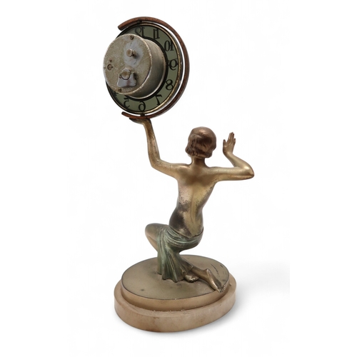 2169 - AN ART DECO FIGURAL CLOCKmodelled as a kneeling semi clad female holding aloft the circular clock, u... 