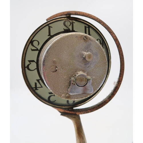 2169 - AN ART DECO FIGURAL CLOCKmodelled as a kneeling semi clad female holding aloft the circular clock, u... 