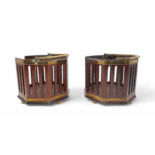 2217 - A PAIR OF GEORGE III MAHOGANY AND BRASS PLATE BUCKETSof octagonal form with pierced sides and shaped... 