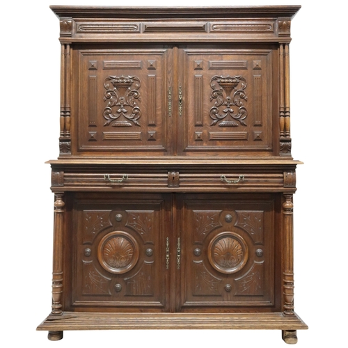 2028 - A 19TH CENTURY CARVED OAK CONTINENTAL COURT CABINET with carved moulded cornice over pair of ca... 