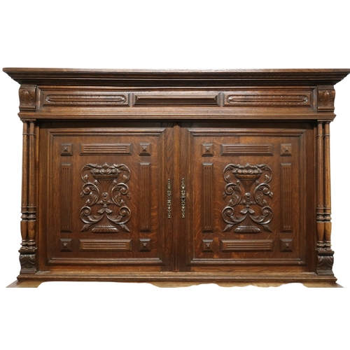 2028 - A 19TH CENTURY CARVED OAK CONTINENTAL COURT CABINET with carved moulded cornice over pair of ca... 