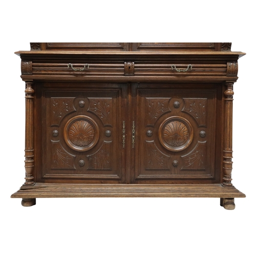 2028 - A 19TH CENTURY CARVED OAK CONTINENTAL COURT CABINET with carved moulded cornice over pair of ca... 