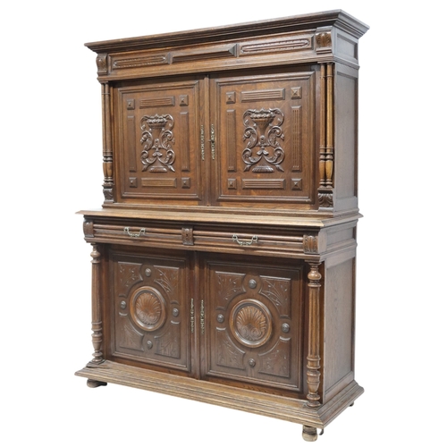 2028 - A 19TH CENTURY CARVED OAK CONTINENTAL COURT CABINET with carved moulded cornice over pair of ca... 