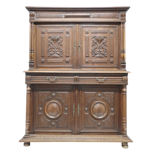 2028 - A 19TH CENTURY CARVED OAK CONTINENTAL COURT CABINET with carved moulded cornice over pair of ca... 