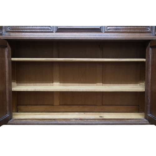 2028 - A 19TH CENTURY CARVED OAK CONTINENTAL COURT CABINET with carved moulded cornice over pair of ca... 