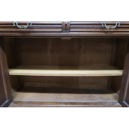 2028 - A 19TH CENTURY CARVED OAK CONTINENTAL COURT CABINET with carved moulded cornice over pair of ca... 