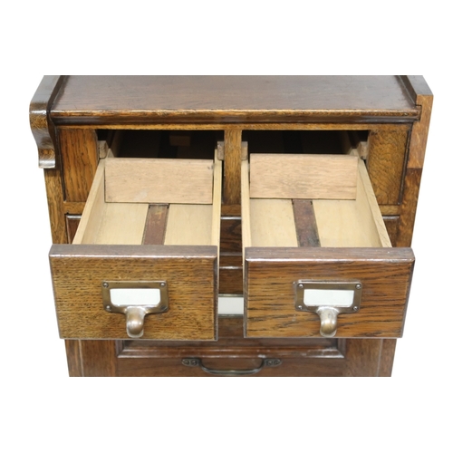 2041 - AN EARLY 20TH CENTURY OAK FILING CABINETwith pair of index card drawers over three filing drawers on... 