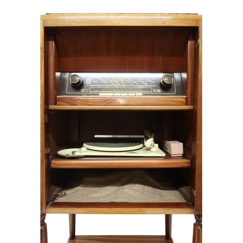 2044 - AN EARLY 20TH CENTURY MAHOGANY AND SAMPLE WOOD VENEERED RADIOGRAM CABINET with single door inla... 