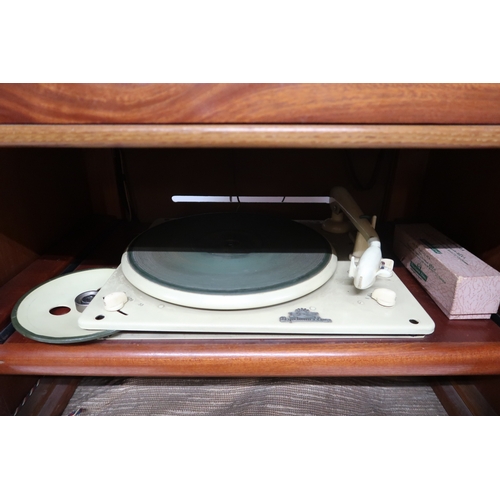 2044 - AN EARLY 20TH CENTURY MAHOGANY AND SAMPLE WOOD VENEERED RADIOGRAM CABINET with single door inla... 