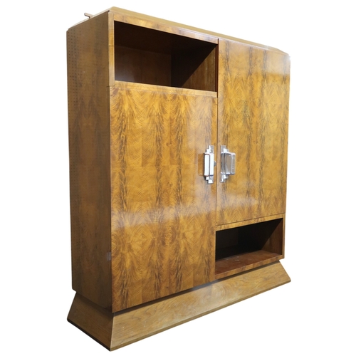 2049 - AN ART DECO FERNAND & GASTON SADDIER FLAME WALNUT VENEERED BOOKCASEwith chamfered top over pair ... 