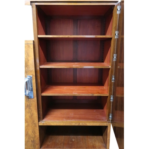 2049 - AN ART DECO FERNAND & GASTON SADDIER FLAME WALNUT VENEERED BOOKCASEwith chamfered top over pair ... 