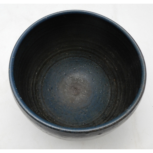 2229 - DAVID LLOYD JONES (1928-1994)A LARGE STUDIO POTTERY BOWLglazed in blue with ribbed detail, upon thre... 