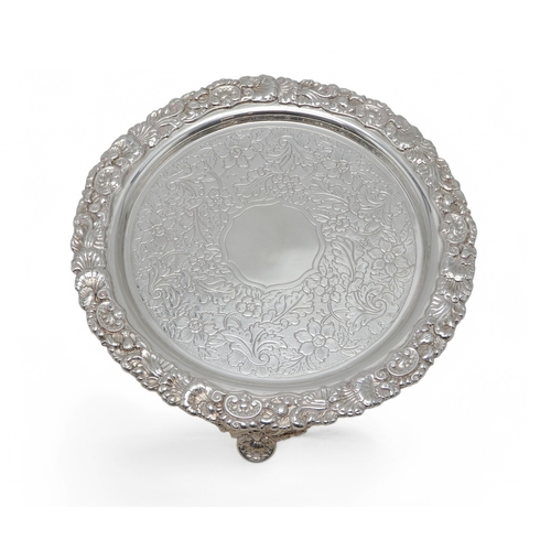 2368 - AN EDWARDIAN SILVER WATERby Cornelius Joshua Vander, London 1902, of circular form, with a cast scro... 