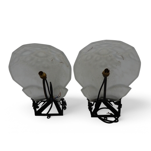 2225 - A PAIR OF FRENCH ART DECO STYLE FROSTED GLASS WALL LIGHTSwithin wrought iron mounts, 18cm diameter (... 