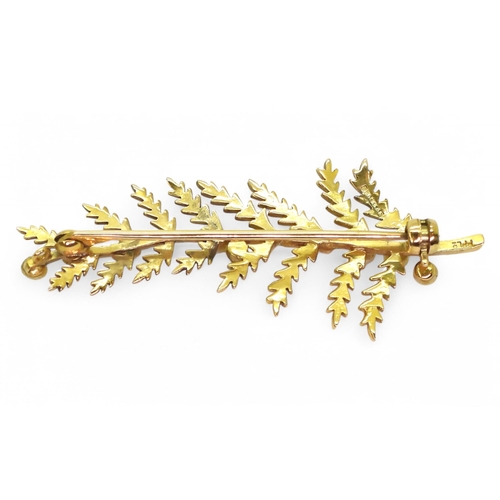 712 - A 9ct gold brooch set with pearls, length 5cm, weight 4.5gms