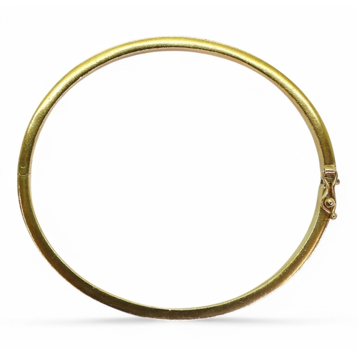 715 - A 9ct gold square section bangle, made from thick gauge gold with a box clasp and safety clip. Inner... 