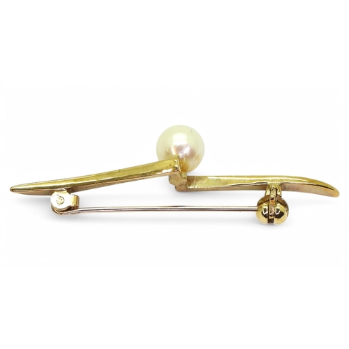 716 - A 9ct gold Mikomoto pearl brooch. Length 5cm, London hallmarks 1987 with Mikimoto MP stamp and brand... 