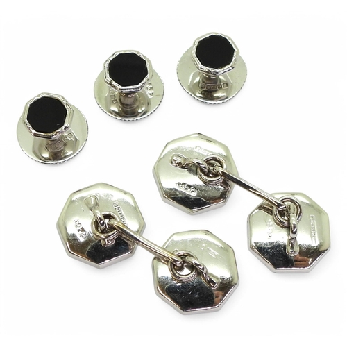 719 - A set of 9ct white gold cufflinks and shirt studs, in original box, weight all together 8.8gms. Lond... 