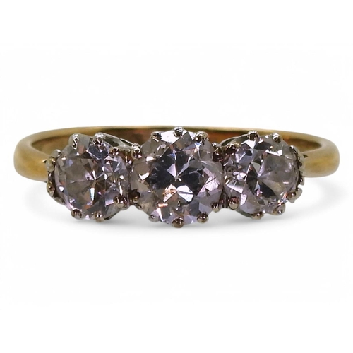 737 - A yellow metal and platinum, three stone diamond ring set with estimated 1.15cts of old cut diamonds... 