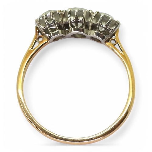 737 - A yellow metal and platinum, three stone diamond ring set with estimated 1.15cts of old cut diamonds... 