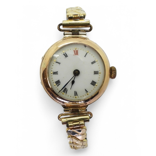 766 - A 9ct gold ladies vintage watch, hallmarked with London import marks for 1912, on a gold plated expa... 