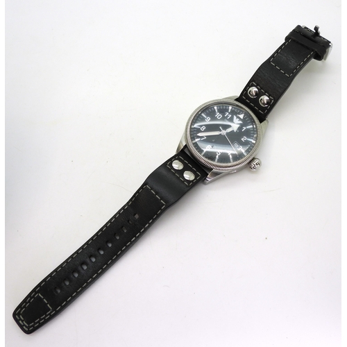 880 - An Emporio Armani gent wristwatch, model AR5834, with original box and paperwork, together with a ye... 