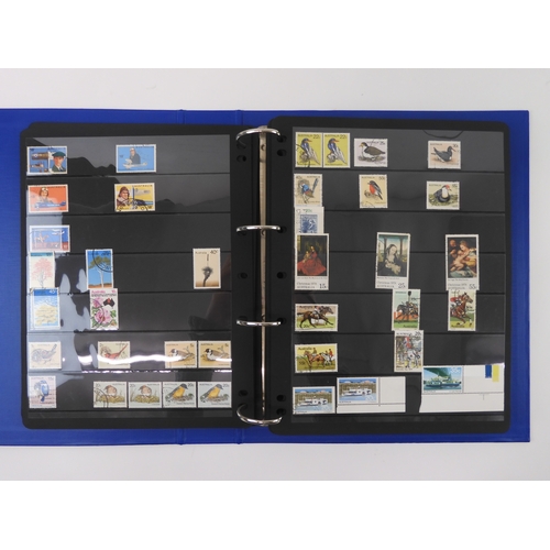 7021 - AUSTRALIA A collection of new and used stamps in three albums and a stock book to include booklets a... 