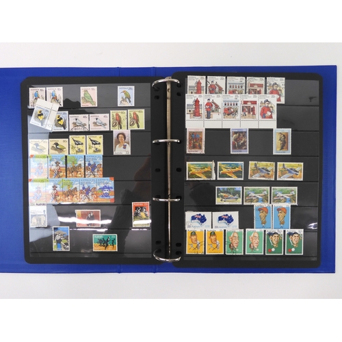 7021 - AUSTRALIA A collection of new and used stamps in three albums and a stock book to include booklets a... 