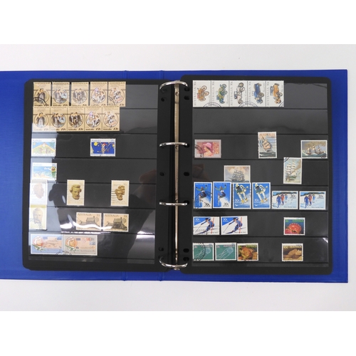 7021 - AUSTRALIA A collection of new and used stamps in three albums and a stock book to include booklets a... 