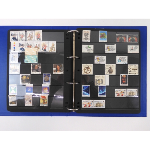 7021 - AUSTRALIA A collection of new and used stamps in three albums and a stock book to include booklets a... 