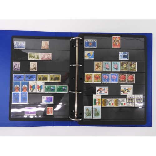 7021 - AUSTRALIA A collection of new and used stamps in three albums and a stock book to include booklets a... 