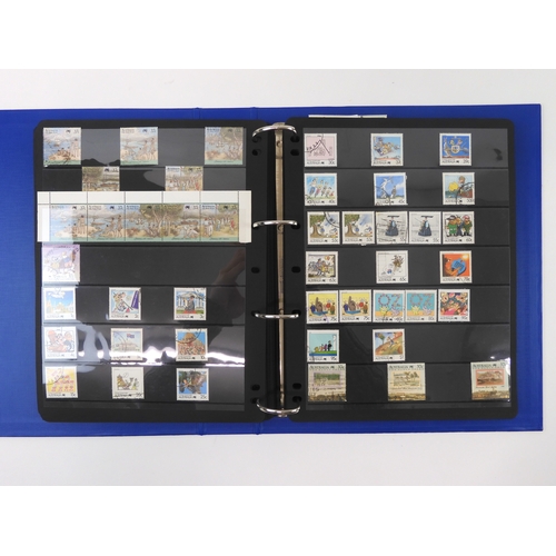 7021 - AUSTRALIA <br />A collection of new and used stamps in three albums and a stock book to include book...