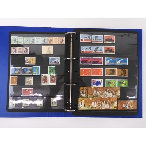 7021 - AUSTRALIA A collection of new and used stamps in three albums and a stock book to include booklets a... 