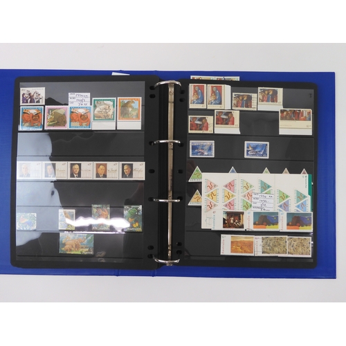 7021 - AUSTRALIA A collection of new and used stamps in three albums and a stock book to include booklets a... 